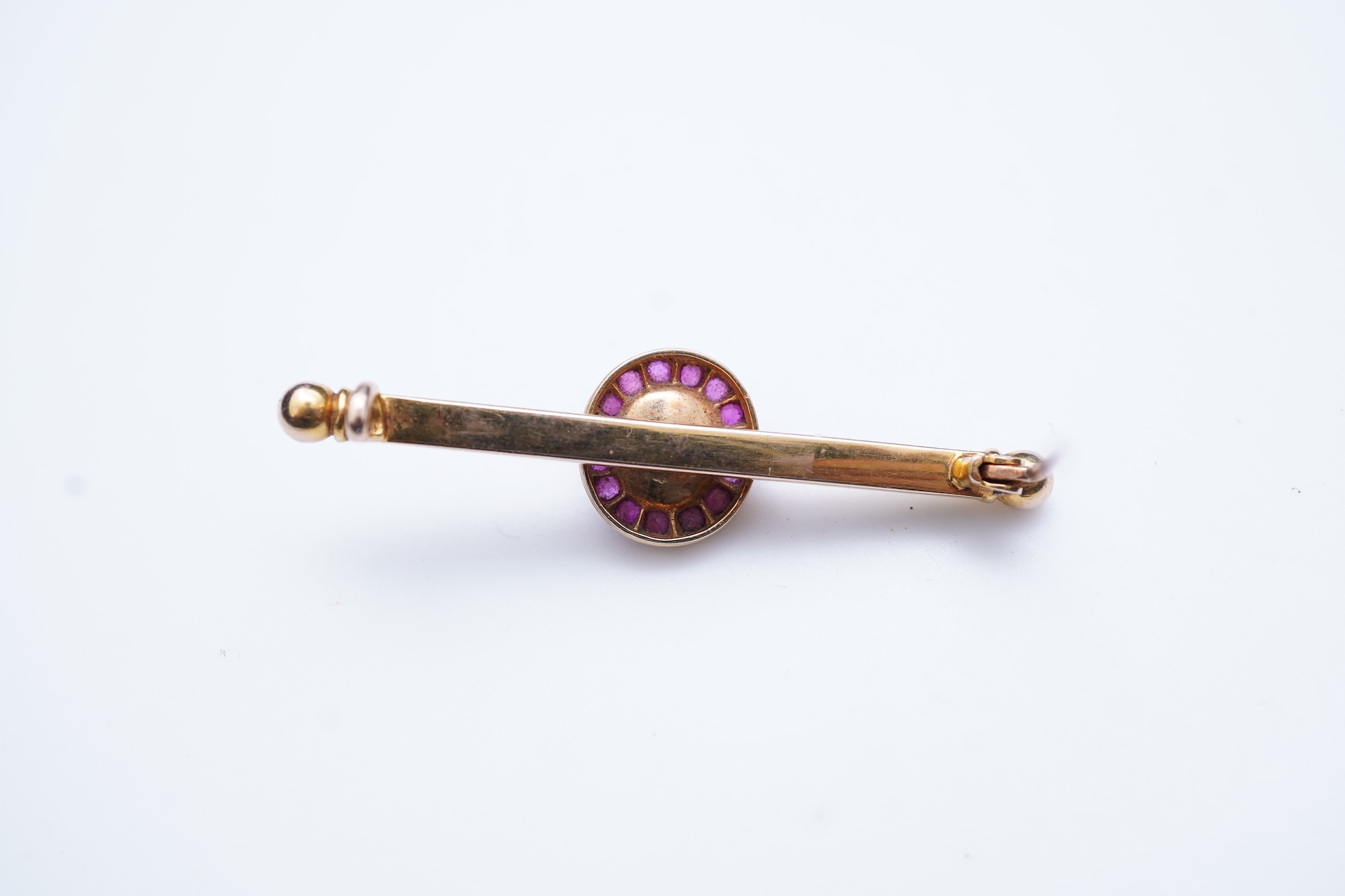 A pearl and ruby bar brooch, 19th century